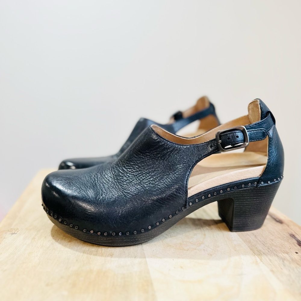 Dansko Black and Tan Mules with Studded Detail